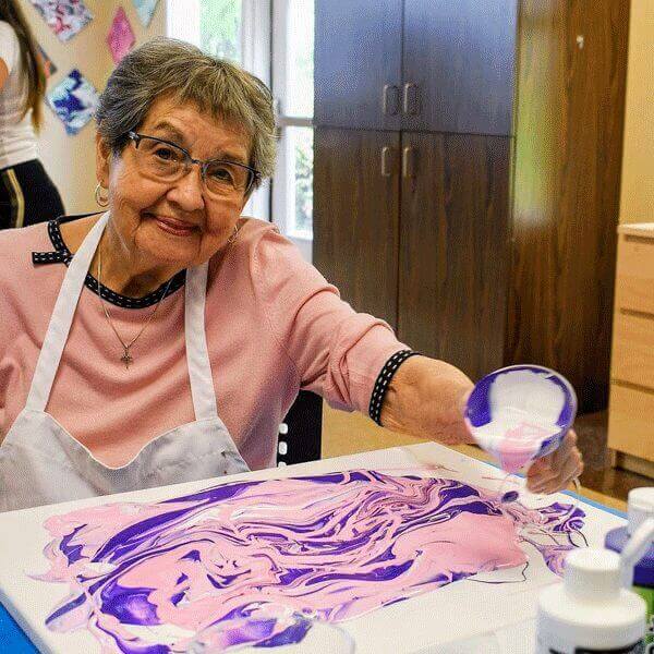 Patricia participating in crafts at Carlton Senior Living